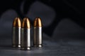 Bullet 9mm. On the dark stone table.rounds and military technology Royalty Free Stock Photo