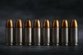 Bullet 9mm. On the dark stone table.rounds and military technology Royalty Free Stock Photo