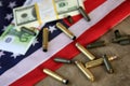 Bullet and money on the american flag