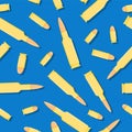 Bullet pattern. Cartoon seamless background with pistol and rifle bullets on gray background. Concept for web, print. Royalty Free Stock Photo