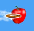 Bullet penetrating an apple Royalty Free Stock Photo