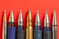 Bullet and pens on red background. Freedom of the press is at risk concept. World press freedom day concept Royalty Free Stock Photo