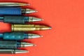 Bullet and pens on red background. Freedom of the press is at risk concept. World press freedom day concept Royalty Free Stock Photo