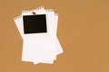 Polaroid photo frame on cork notice board, untidy torn note paper, copy space Royalty Free Stock Photo