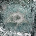 Bulletproof glass after test. bulletproof glass with cracks and a crater from a bullet hit. Testing of armored glass Royalty Free Stock Photo