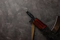 Bullets and ammo magazine with kolashnikov assault rifle on black texture marble. Royalty Free Stock Photo