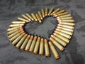 Bullets on the black camo  in the shape of a heart Royalty Free Stock Photo