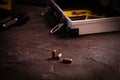 Bullets on black slate table, closeup. Crime scene