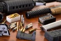 Bullets and a firearm. Bullets are a projectile expelled from the barrel of a firearm, on wooden table Royalty Free Stock Photo