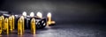 Bullets and handcuffs. Close-up of 9mm pistol. Gun and weapon with bullets amunition on black backround. Top view.