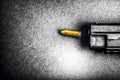 Bullets and handcuffs. Close-up of 9mm pistol. Gun and weapon with bullets amunition on black backround. Top view.