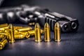 Bullets and handcuffs. Close-up of 9mm pistol. Gun and weapon with bullets amunition on black backround. Top view.