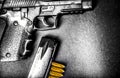 Bullets and handcuffs. Close-up of 9mm pistol. Gun and weapon with bullets amunition on black backround. Top view. Royalty Free Stock Photo