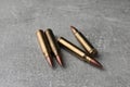 Bullets on light grey table, closeup. Firearm ammunition Royalty Free Stock Photo