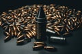 Bullets pile and gun on gray table. Generate Ai