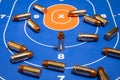 Bullets Scattered on Paper Practice Gun Target Royalty Free Stock Photo