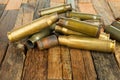 Bullets shell on wooden background.