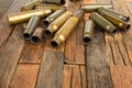 Bullets shell on wooden background.