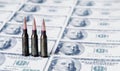Bullets on US Dollar bills as symbol of bloody business, military conflicts and murders. Free copy space for text or design