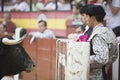 Bullfighters behind the refuge before the look of the brave bull