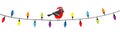 Bullfinch bird in red Santa hat. Lightbulb glowing garland. Christmas lights. Colorful string fairy light set. Cone shape. Holiday