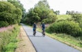 Bullingen, Walloon Region - East Belgium - Elderly couple driving the bicycle on the RAVeL, the cycle trail in a nature park