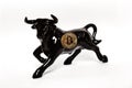 Bullish trend of Bitcoin crypto currency. Bitcoin gold coin and black bull. Virtual cryptocurrency concept