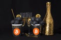 Bullish trend of Bitcoin cryptocurrency. Bitcoin gold coin and ice cream and champagne. Virtual cryptocurrency concept. Black