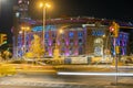 Bullring Arena in Barcelona city, colorfully illuminated building at night