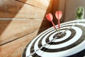 Bulls eye or bullseye target or dart board has red dart arrow throw hitting the center of a shooting for business targeting Royalty Free Stock Photo