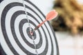 Bulls eye or dart board has red dart arrow throw hitting the center of a shooting target for business targeting Royalty Free Stock Photo