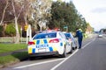 A Police officer pulls over a speeding driver on the main road of Bulls in New Zealand.