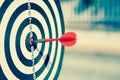 The bullseye, or bull`s-eye or dart board has dart arrow hitting the center of a shooting target for business targeting Royalty Free Stock Photo