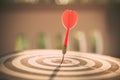 The bullseye, or bull`s-eye or dart board has dart arrow hitting the center of a shooting target for business targeting Royalty Free Stock Photo