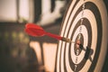 The bullseye, or bull`s-eye or dart board has dart arrow hitting the center of a shooting target for business targeting Royalty Free Stock Photo