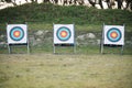 Bullseye target board, outdoor and field at shooting range for weapon training, aim and accuracy. Sports, archery and