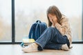 Bullying, discrimination or stress concept. Sad teenager crying in school Royalty Free Stock Photo