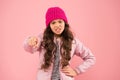 Bullying and shaming. Little girl winter clothes pink background. Childhood concept. Emotional girl long hair knitted Royalty Free Stock Photo