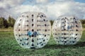 Bumper-balls for soccer playing on a green lawn