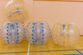 Bumper-balls for soccer playing on a green lawn, a new funsport