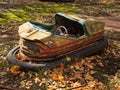 Bumper car in abandoned amusement park in Pripyat, Chernobyl Exclusion Zone in autumn. Ukraine. Royalty Free Stock Photo