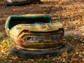Bumper car in abandoned amusement park in Pripyat, Chernobyl Exclusion Zone in autumn. Ukraine. Royalty Free Stock Photo