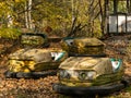 Bumper cars in abandoned amusement park in Pripyat, Chernobyl Exclusion Zone in autumn. Ukraine.. Royalty Free Stock Photo