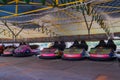 ARAD, ROMANIA, 12 APRIL, 2024: Colorful bumper cars in amusement park waiting for the summer season to open.