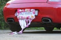 Bumper of limousine with just married sign attached.