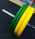 Bumper Plates on a weight lifting barbell Royalty Free Stock Photo