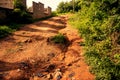 Bumpy road heavily eroded hill road Royalty Free Stock Photo