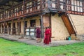 Bumthang, Bhutan - September 13, 2016: Three monks at the Kurjey Lhakhang (Temple of Imprints) in Bumthang valley.