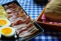 Bun, bacon, cheese and hard boiled eggs Royalty Free Stock Photo