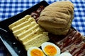 Bun, bacon, cheese and hard boiled eggs Royalty Free Stock Photo